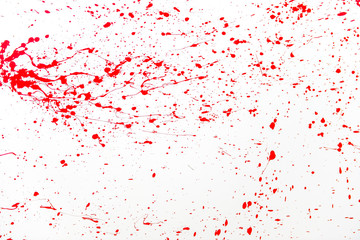 Fototapeta premium Blood splatter, red acrylic paint splash isolated on wall background texture