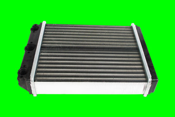 Engine cooling radiator isolated on green background. Auto spare parts for passenger car. Chromakey