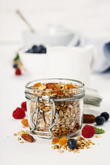 Healthy breakfast -  Homemade granola, honey, milk and berries
