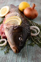 raw fish (carp) with lemon, onion and herbs thyme