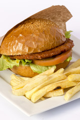 Cheeseburger and fries on restaurant table