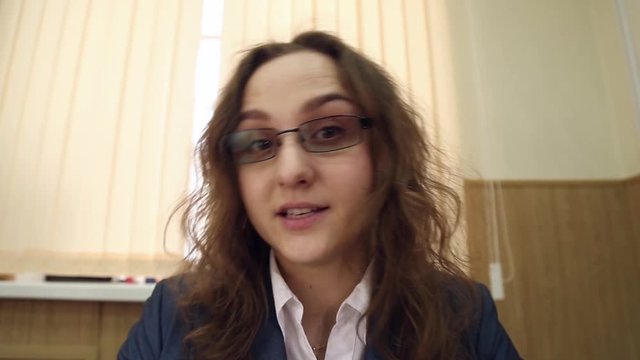 Strict boss, the evil headmistress in glasses gives orders
