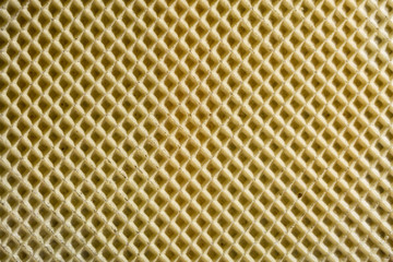 Фон и текстура поверхности кондитерской вафли жёлтого цвета 