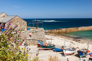 Boats in Sennen Cove Harbour Cornwall on a fine summers day