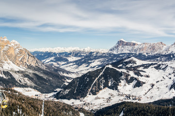 Fototapeta na wymiar Cloudy view of Dolomite Alps near Alta Badia of Val di Fassa, Trentino-Alto-Adige region, Italy.