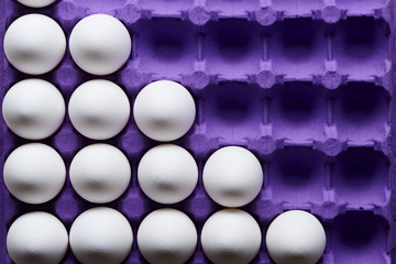 White eggs pattern in purple carton pack
