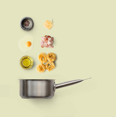 Cooking ingredients for italian food, carbonara, isolated on yellow background
