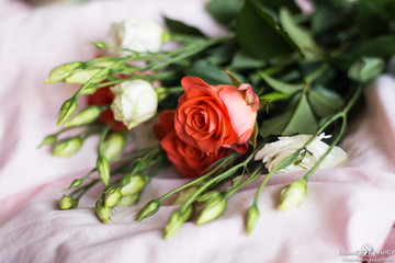 Pink roses in bouquet with ranunkulyus