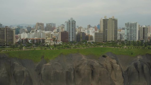 Lima Peru Aerial v31 Flying low over coastline panning with views of cliff side parks in Miraflores.