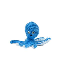 handmade knitting octopus toy isolated on a white background