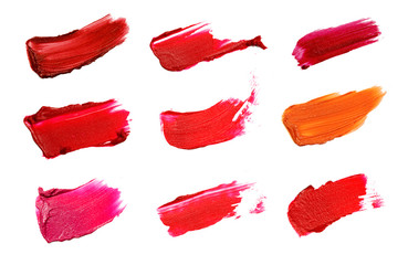 Collage of decorative cosmetics  color brush lipstick strokes on white background. Beauty and makeup concept.