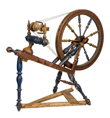 Old wooden spinning wheel isolated on white