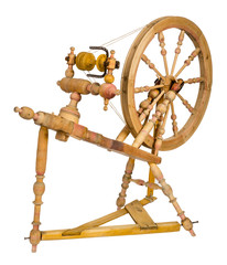 Old wooden spinning wheel isolated on white