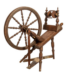 Old wooden spinning wheel isolated on white