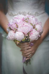 beautiful wedding bouquet in hands of the bride