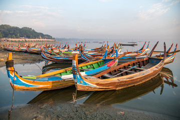 Fototapeta na wymiar traditional boat near the U Bein Bridge, Mandalay, Myanmar