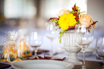 Beautiful restaurant interior table decoration for wedding or event. Flower Wedding Table Decoration/ Autumn colors.