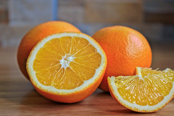 Closeup of oranges on a wooden table