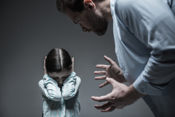 Angry male person keeping his hands in the air