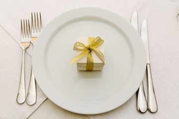Wedding Bonbonniere on plates with gold ribbon
