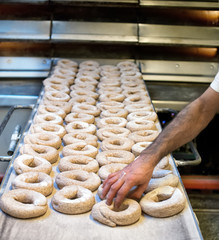 Putting frisella bread into oven