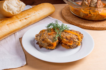 Homemade meatballs roasted with vegitables in ceramic bowl, classic recipe.