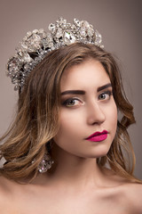 Beautiful girl with a tiara on her head © pushann