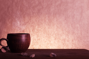 Coffee cup and  brown sugar wooden background. Vintage color tone