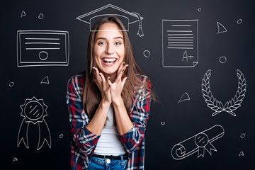 Positive graduate student celebrating graduation