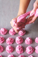 Raws of homemade marshmallow dessert making with cream injector