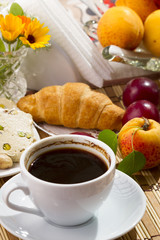 Breakfast with coffee and croissant