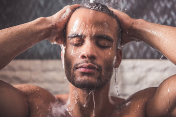 Afro American man taking shower