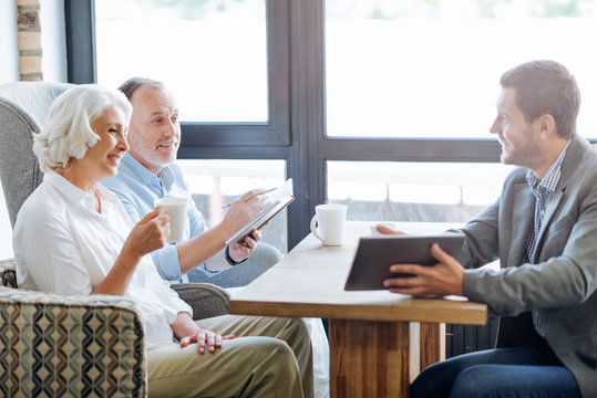 NIce Smiling Aged Couple Having Meeting In The Cafe