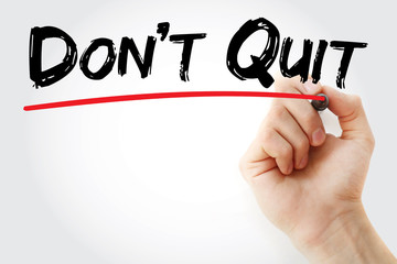 Hand writing Do Not Quit with marker, concept background
