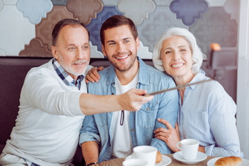 POsitive couple and grandso making selfies