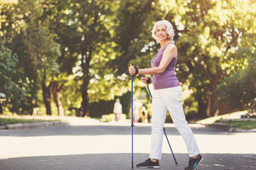 Nice elderly woman doing sports activities