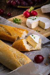 Cheese, radish, grapes and baguette