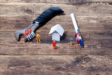  project discussion.concept.little toy people and paper house