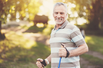 Delighted well built man enjoying his walk