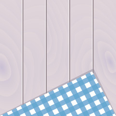 Wooden background with plaid tablecloth