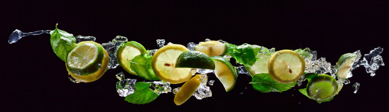 lime , lemon and  peppermint on a black background