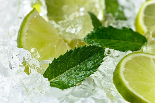  lime slices and mint leaves on ice