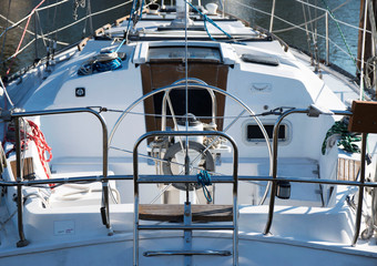 The back of a sailboat that is docked