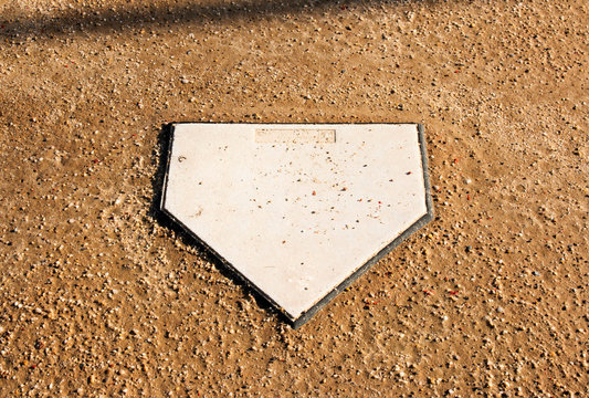 Home plate on a softball dirt field