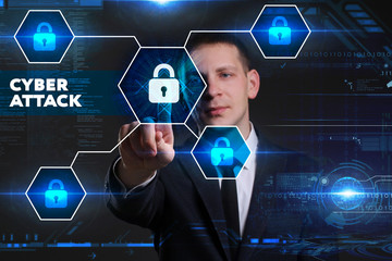 Business, Technology, Internet and network concept. Young businessman working on a virtual blackboard of the future, he sees the inscription: cyber attack