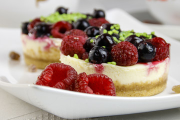 mini cheesecakes with mixed berries