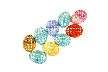Easter eggs are in lacy multi-colored clothes isolated