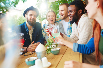 Several buddies spending time with drinks