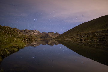 Reflection of stars in Alpine Lake