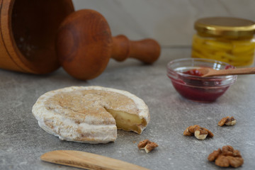 Delicious cheese and jam on the stone table
